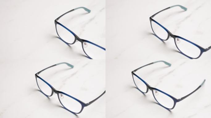 对放在桌子上的一副眼镜的特写镜头进行平移。