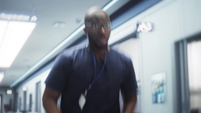 医院的紧急情况:男医生或护士在走廊里跑来跑去，急着拯救生命。年轻的黑人医疗专业人员报到，赶着去帮助他