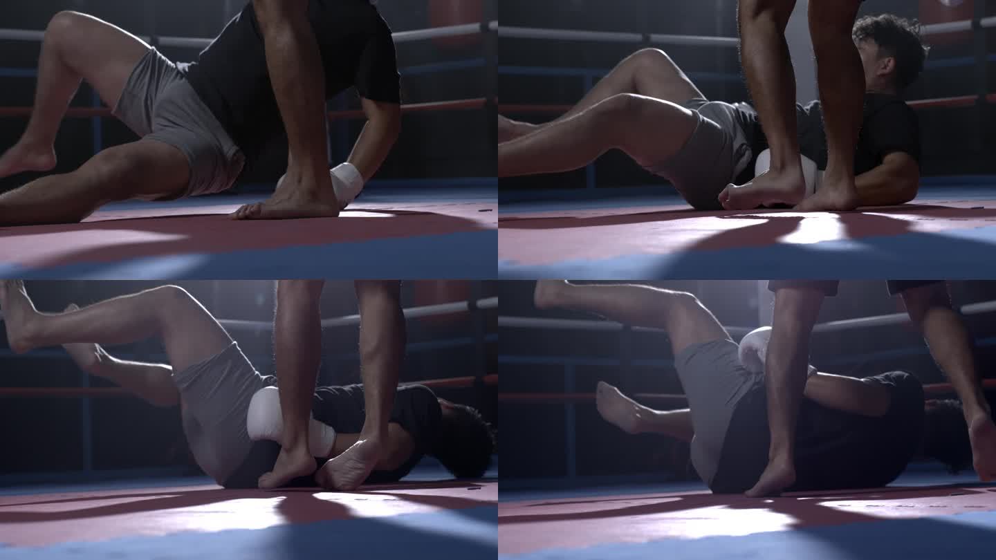 拳手以800帧/秒的超级慢动作低腿踢倒对手，使其倒地。竞争对手可拆卸的