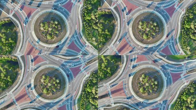 鸟瞰图美国道路上的环形交叉路口与移动的交通车辆。城市循环交通十字路口
