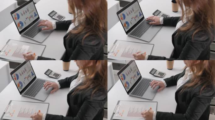商务女性带着科技小玩意笔记本电脑，准备迎接现代商业环境的挑战。专家，专业解决问题的热情和信心，在电脑