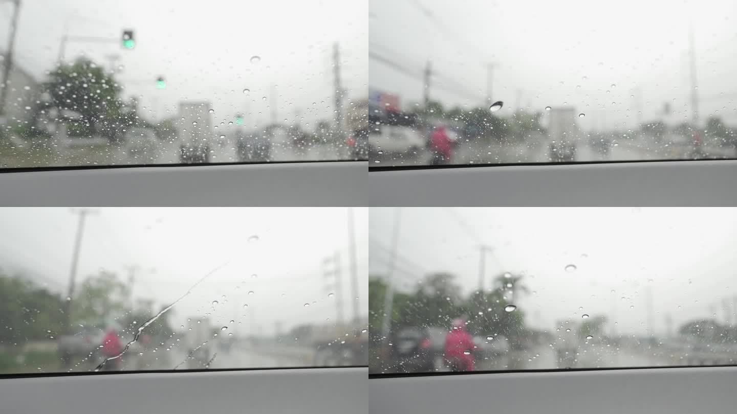 在大雨中开车旅行时天气很恶劣。中午从侧窗往外看，雨下得很大。