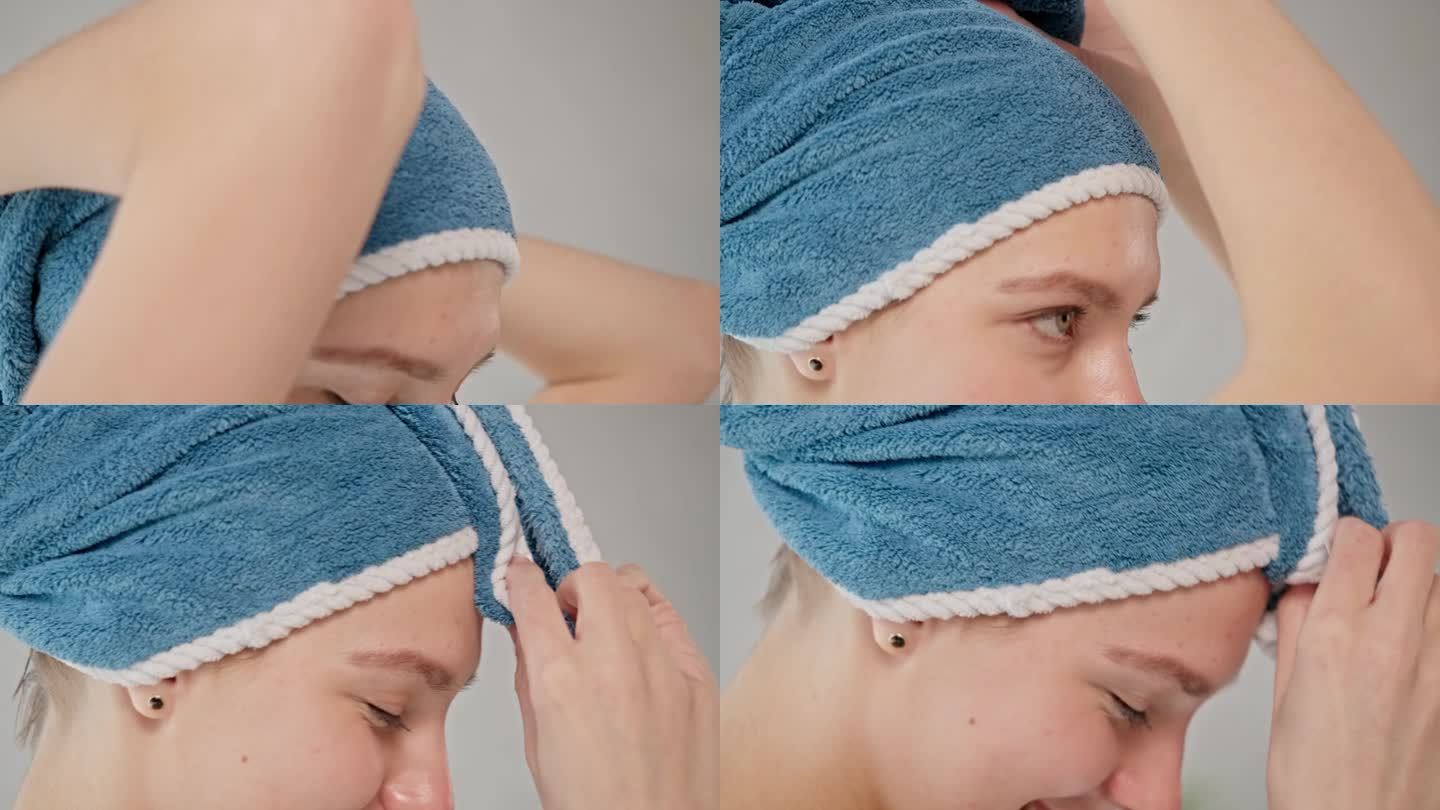 年轻女子沐浴后用毛巾包着头发。