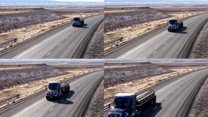 在一个阳光明媚的冬日，在双车道的州际公路上，手持拍摄了一辆半挂车和一辆装满物资的平板拖车