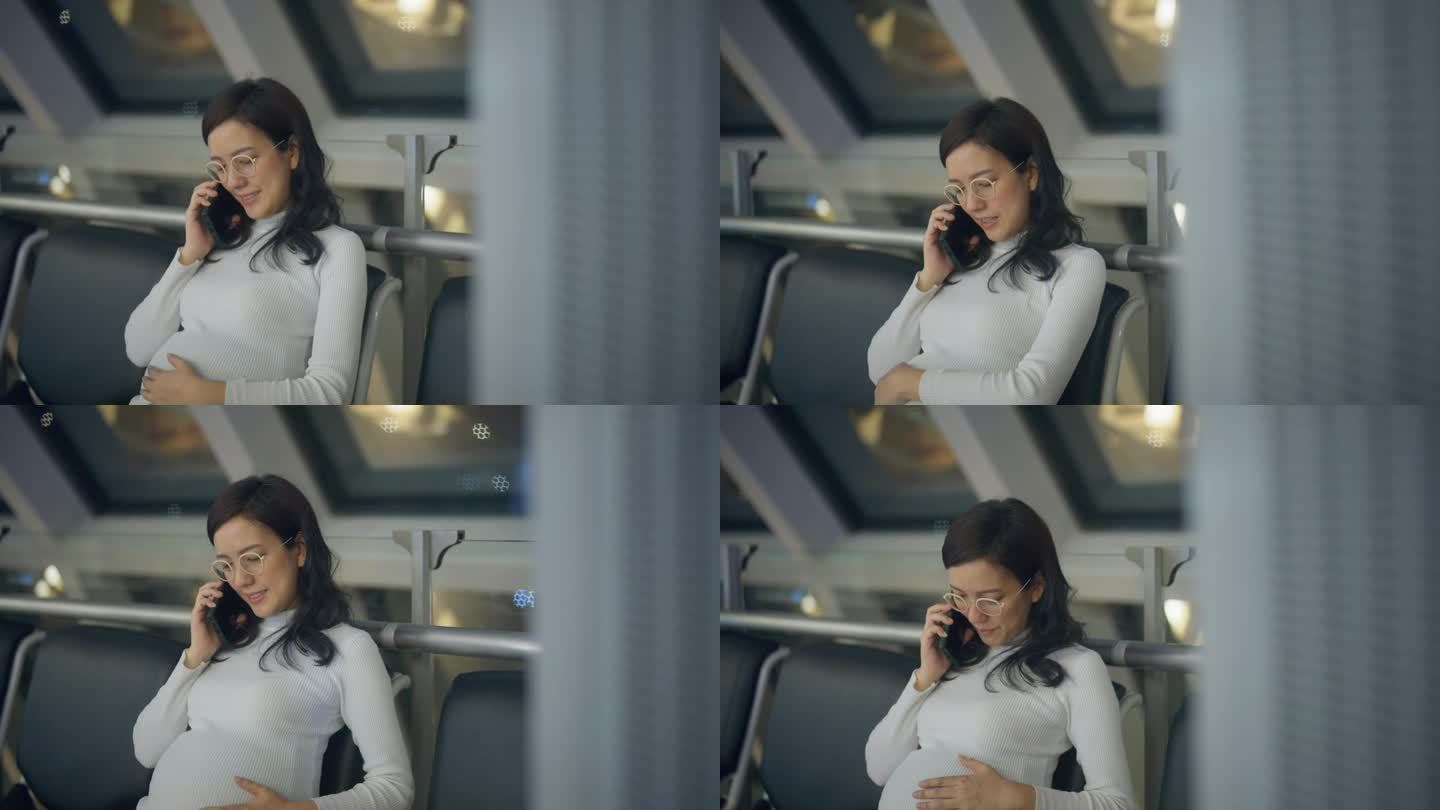 一名孕妇在国际机场门口等着打电话