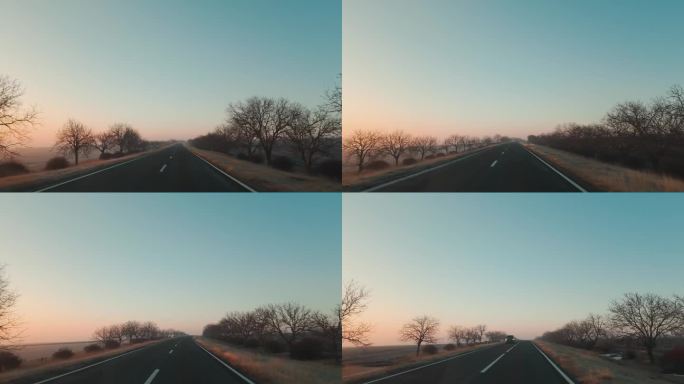 在日出的早晨，看到车窗和前方的道路，阳光灿烂