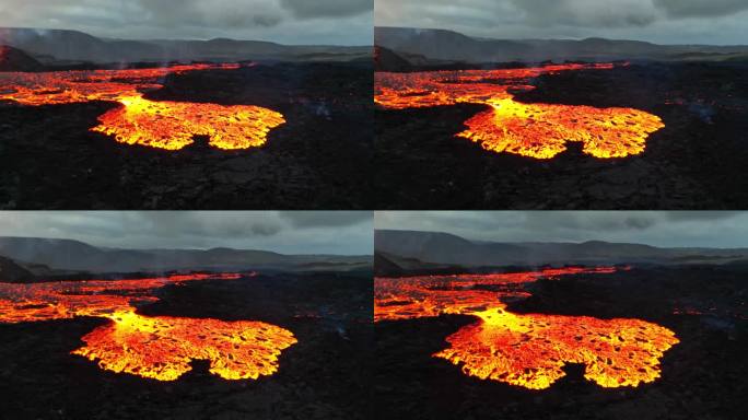 迷人的熔岩景观。热气腾腾的熔岩从火山口流出的航拍照片。自然事件之美。岩浆的特写镜头。夜晚的熔岩。世界