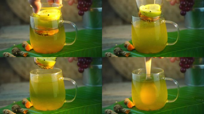 用姜黄、黑胡椒、蜂蜜和柠檬制作草药饮料的过程。