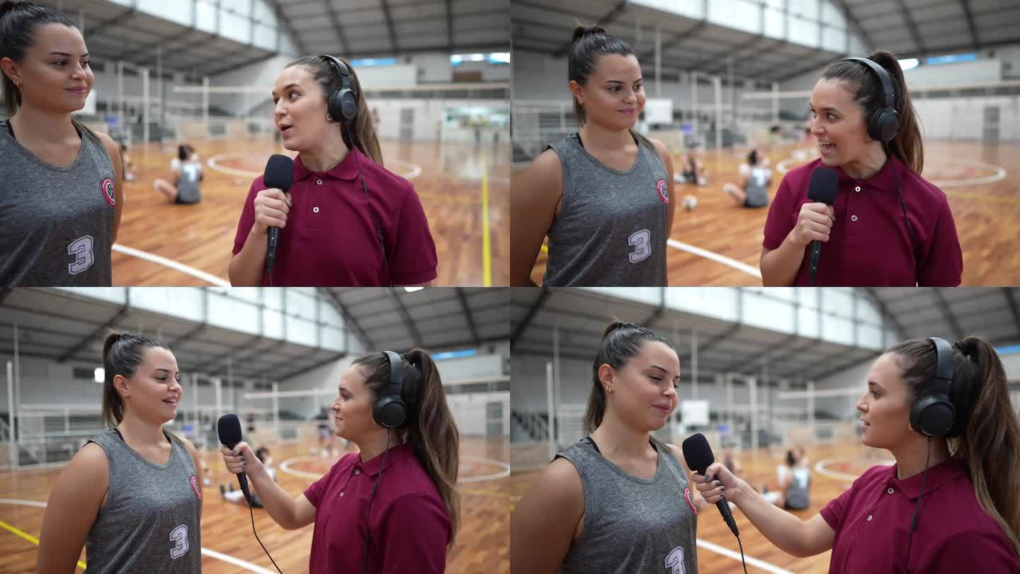 年轻的女电视记者在体育场上采访女排运动员