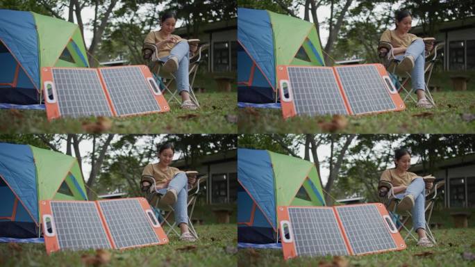 带着太阳能电池板野营的女人，可持续的生活理念