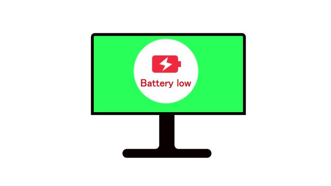 在绿色屏幕背景上显示电池电量不足图标的动画计算机显示器。