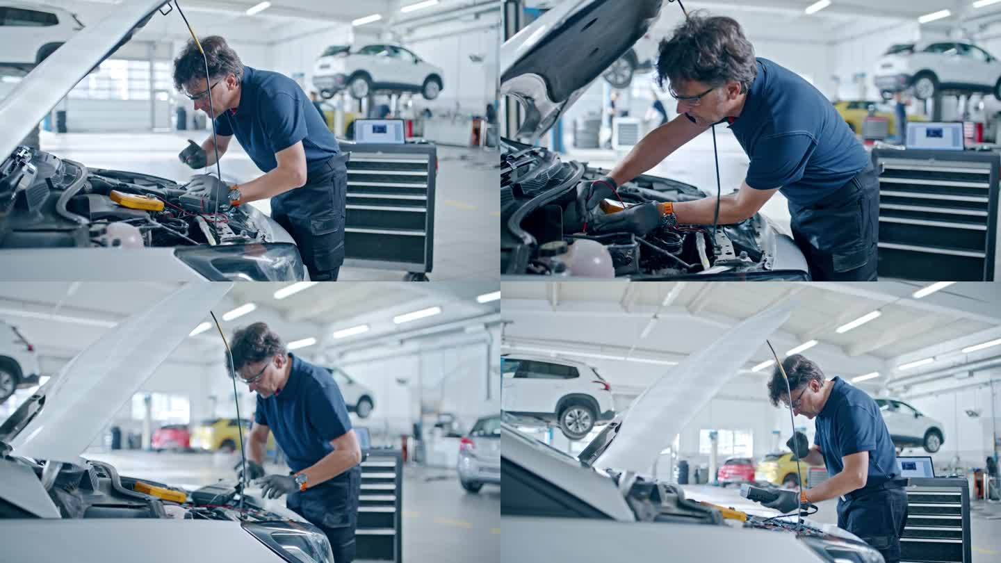 男技工在汽车修理厂对汽车发动机进行诊断试验