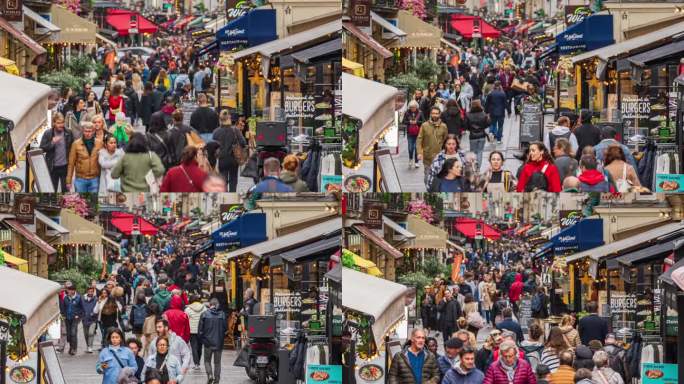 法国巴黎，拥挤的人群和游客在Rue Montorgueil路街，美食和饮料街散步观光的时间流逝