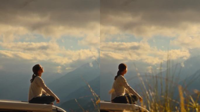 SLO MO女子在曼加特山令人惊叹的山峰之间的屋顶上沉思宁静