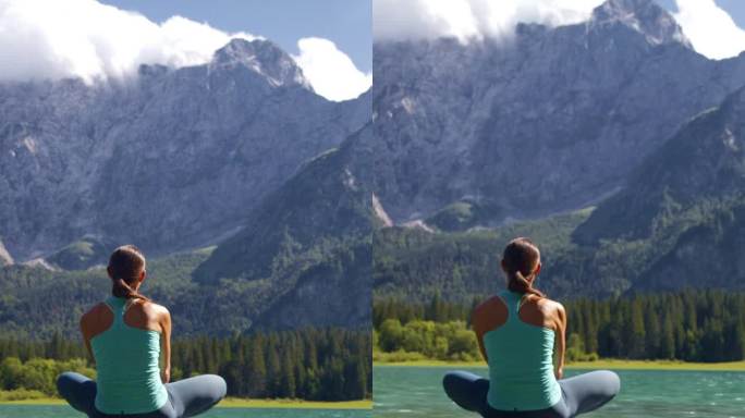 女徒步旅行者坐在岩石上的后视图，欣赏落基山脉之间湖泊的美景