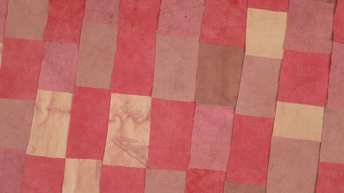 色彩丰富的复古纺织品背景与红色色调的织物元素