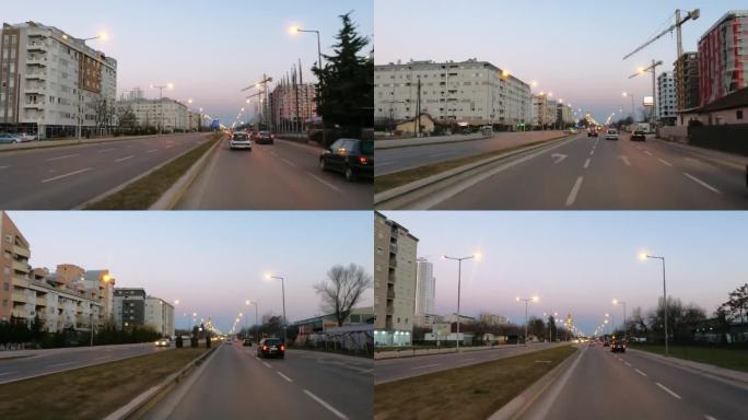 在马其顿斯科普里的城市街道上，日落时分，车辆拥挤的黄昏