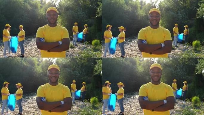 河岸上的年轻男性自然保护志愿者