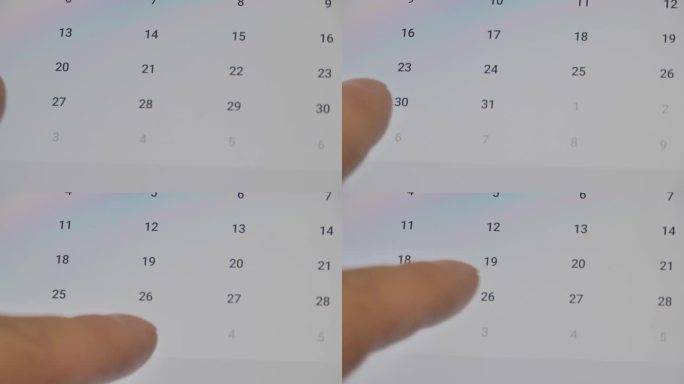 智能手机的特写，手指滚动日历寻找正确的日期。确认会议或约会