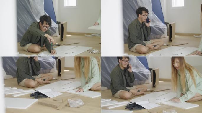 这张照片拍的是一个男朋友坐在地板上，组装平板家具，接听智能手机，而他的女朋友给他拿了一块木头，帮他看