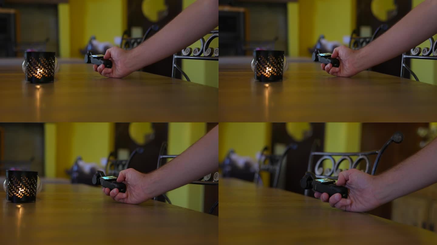 视频记录器记录在桌子表面与DJI Osmo口袋3稳定手持万向移动相机。慢动作