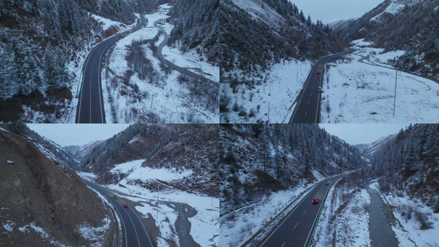 车辆行驶在下雪的山谷中