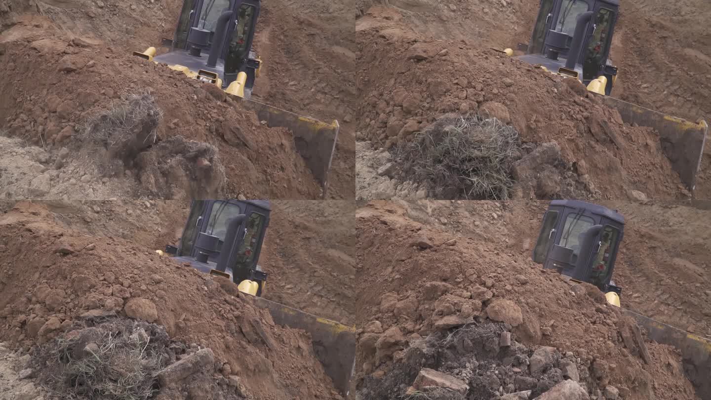 现代挖掘机正在建筑工地推一大堆土