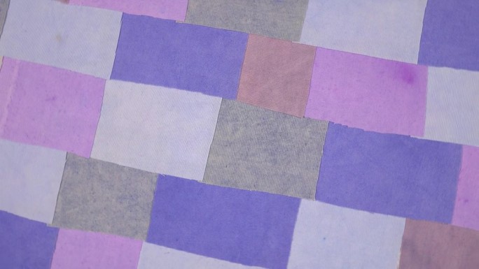 色彩丰富的复古纺织品背景与紫色色调的织物元素
