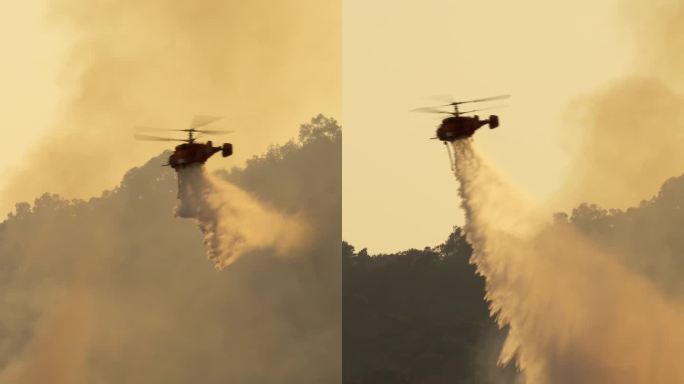 消防直升机向野火洒水