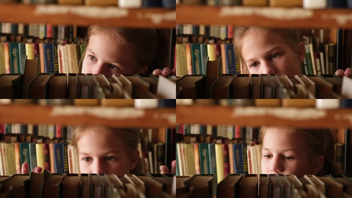 小女孩在旧图书馆的书架上挑书。选文学读物的女学生