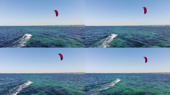 在阳光明媚的日子里，在开阔的海面上玩风筝冲浪