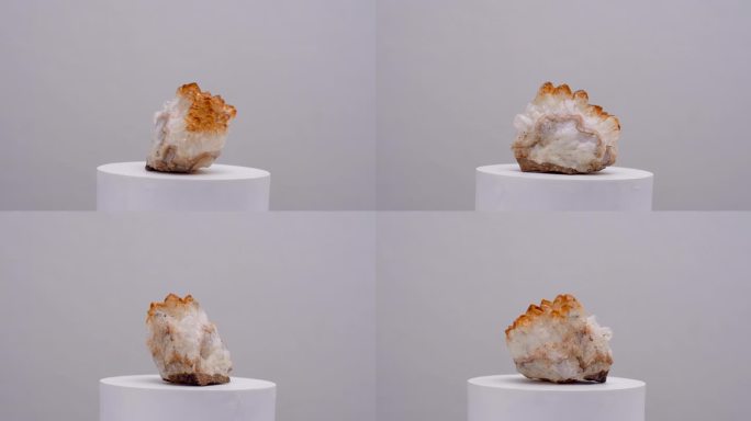 黄水晶金色石英晶体为治疗能量治疗的迷幻矿物黄色岩石旋转拍摄在白色表面
