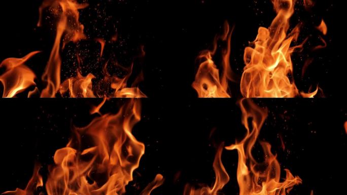 黑色背景上的火焰和火花。一个大篝火。火灾和危险。壁炉里燃烧的木头。浪漫的火。晚上生火。