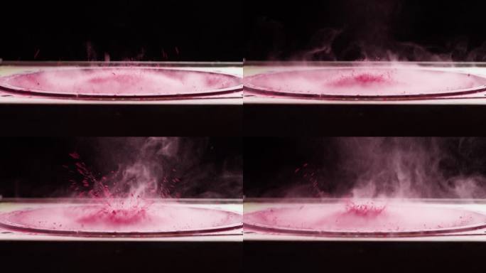 低音炮与粉红色油漆粉末。低音扬声器，大音量音乐微距拍摄。专业的迪斯科演播室设备。音乐立体声系统的重放