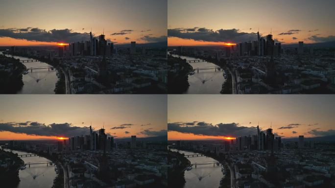 鸟瞰图德国，日落时分，法兰克福与美因天际线的实时镜头，尽管美因河和现代金融大楼和摩天大楼，