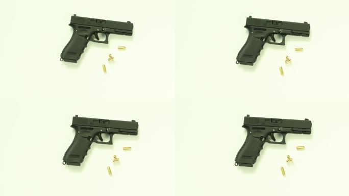 手枪金色的子弹和黑色的手枪