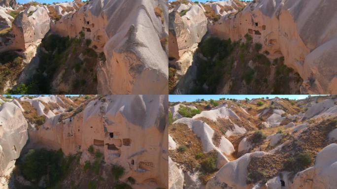 踏上这段迷人的航拍视频的视觉之旅，捕捉土耳其戈雷梅附近卡帕多西亚洞穴民居的精髓。鸟瞰视角揭示了无缝雕