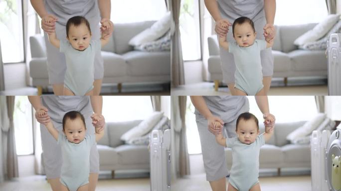 母亲在家里训练儿子学走路
