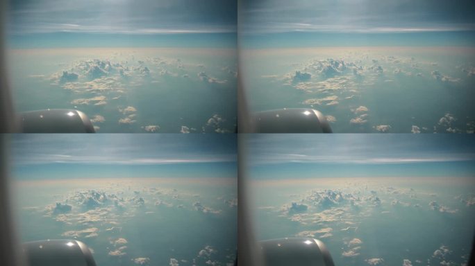 蓝天白云，飞机舷窗的视野很开阔。
