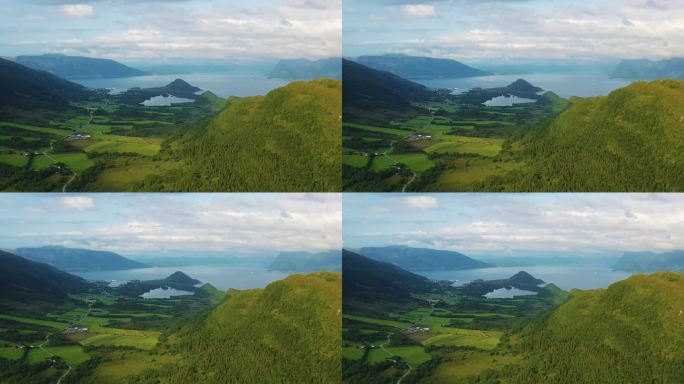 空中风景夏季斯堪的纳维亚景观与山道到峡湾日落期间