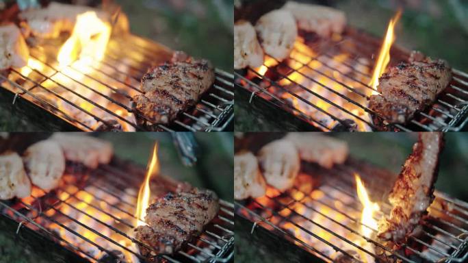 烤熟的多汁的牛排，肉，牛肉刷在烤肉架上的牛排