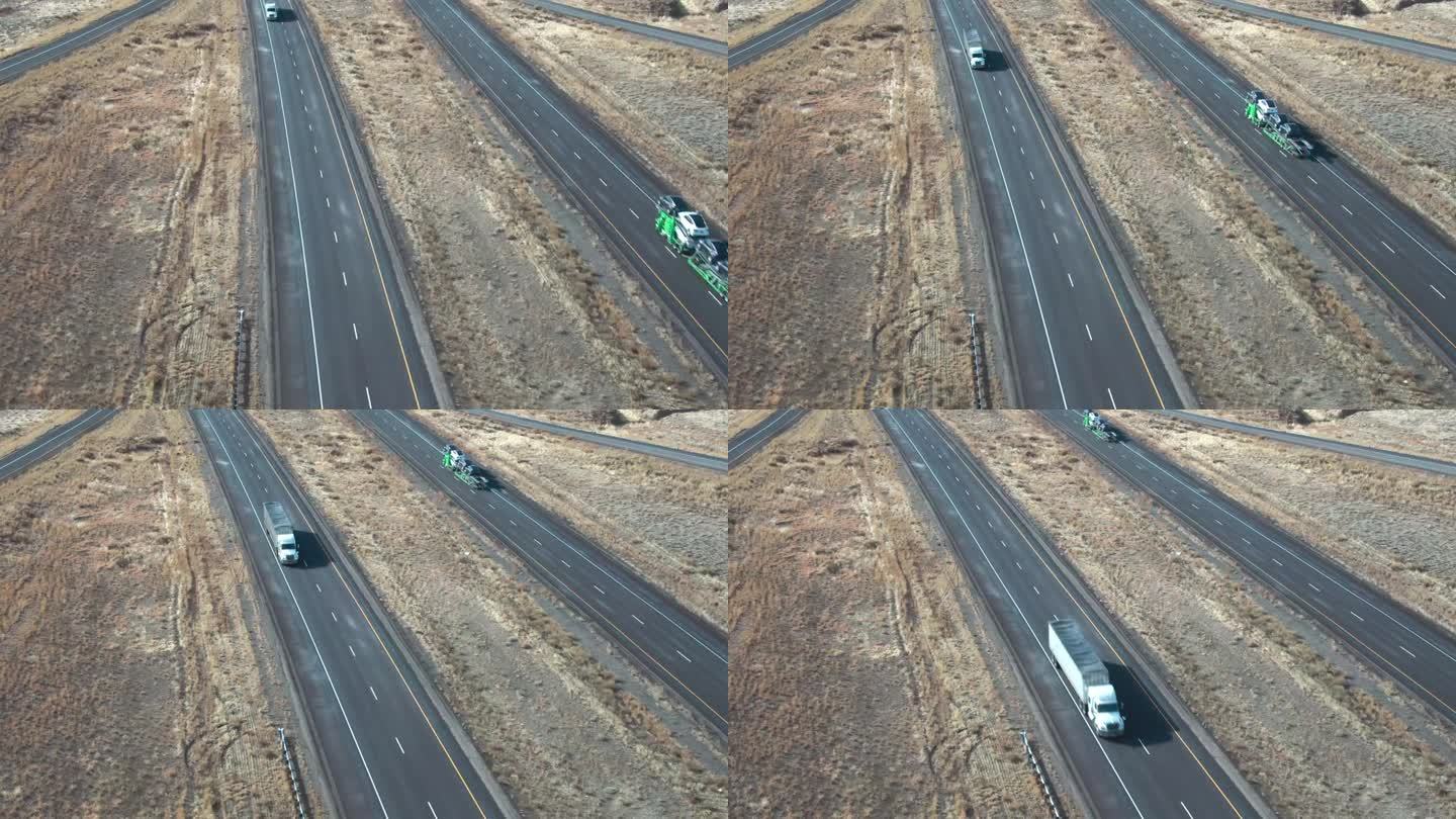 无人机拍摄的一辆白色半挂车在一个阳光明媚的冬日在犹他州I-70上向东行驶