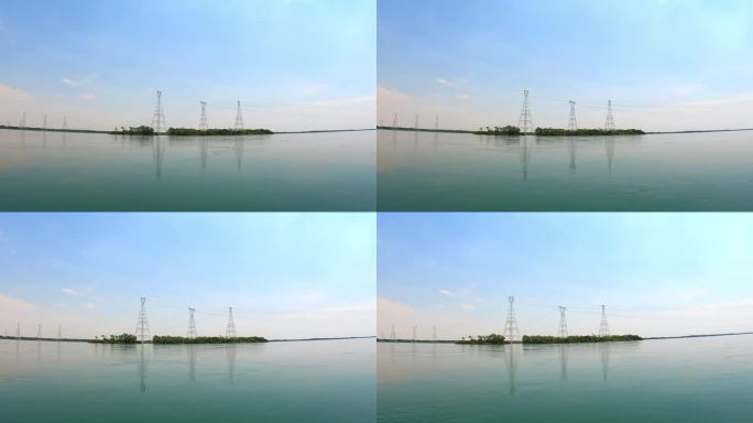巴西南马托格罗索州，在河上航行，可以看到安装在巴拉那河上的230千伏输电塔，这些输电塔用于向高消费城