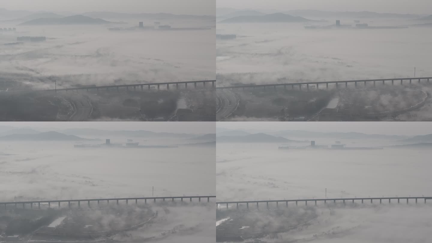 航拍威海双岛湾跨海大桥的冬季平流雾