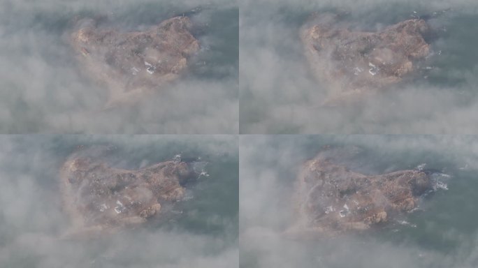 航拍俯瞰冬季平流雾中的威海双岛湾大岛
