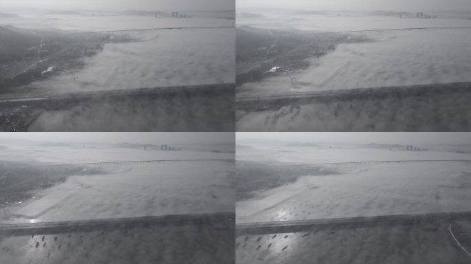 航拍威海双岛湾跨海大桥的冬季平流雾