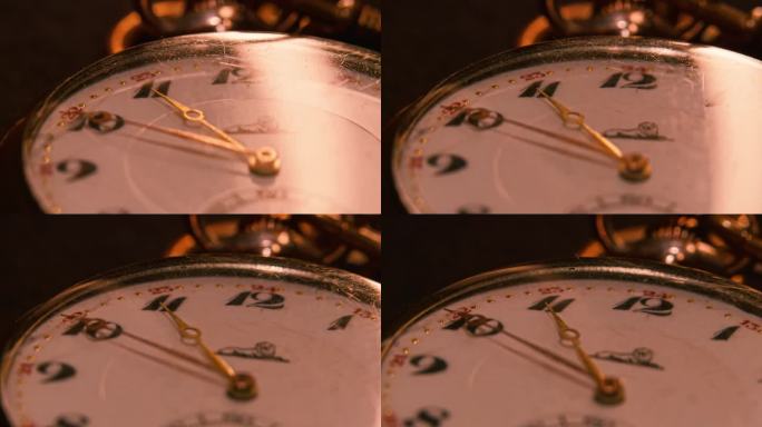 带有玻璃罩的老式怀表的表盘。随着反射在表面上的移动，相机正朝着时钟的轨道移动。