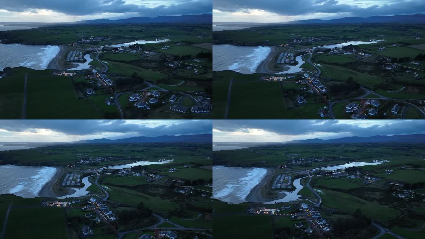 夜间无人机接近电影邦马洪村铜海岸沃特福德爱尔兰在一个冬天的晚上与新的海岸警卫队站