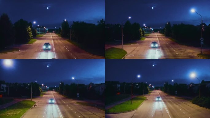 夜晚，月亮在天空中，夏天，汽车驶过城市街道上的减速带。无人驾驶飞机。