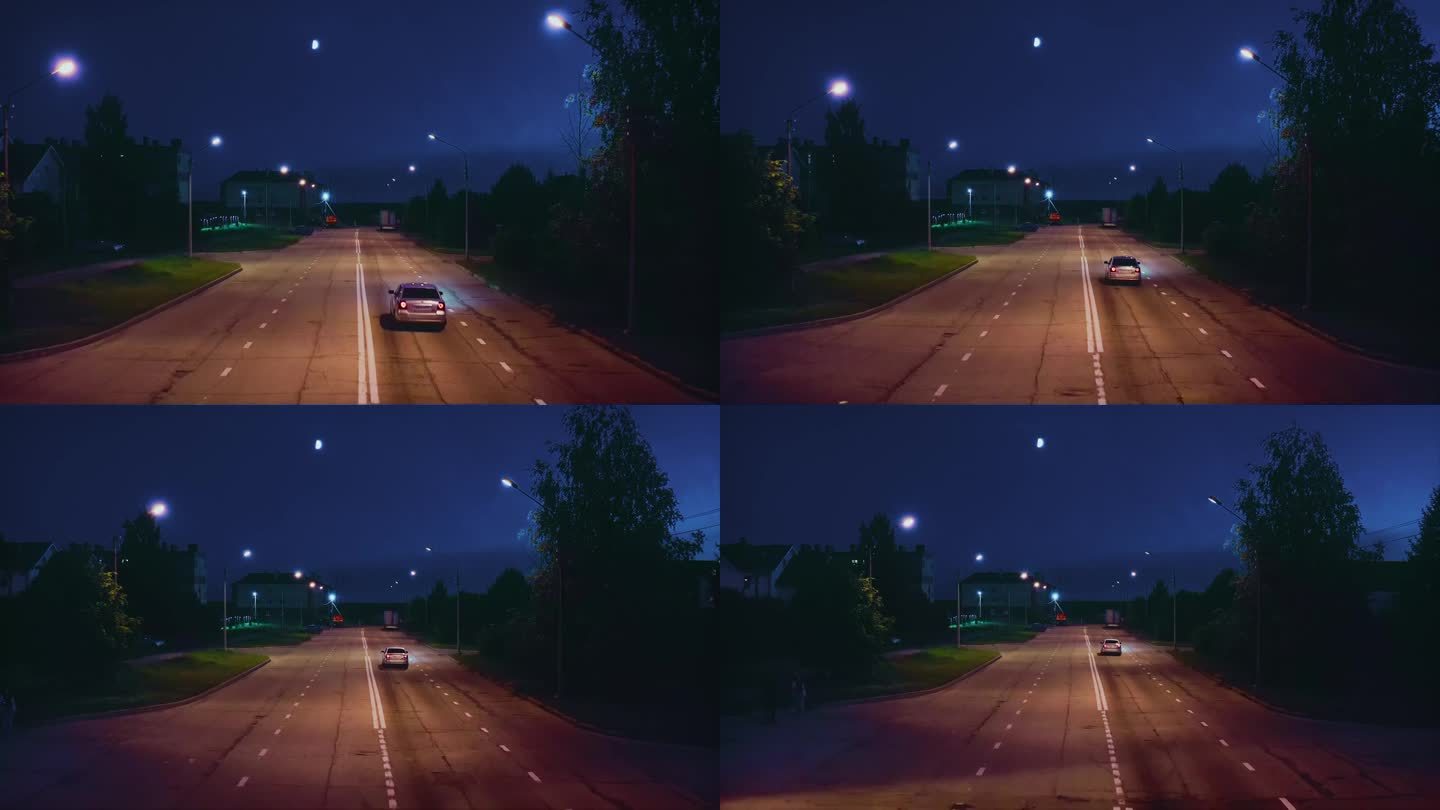 夜深人静的郊区街道上，一辆孤独的汽车驶过。无人驾驶飞机。